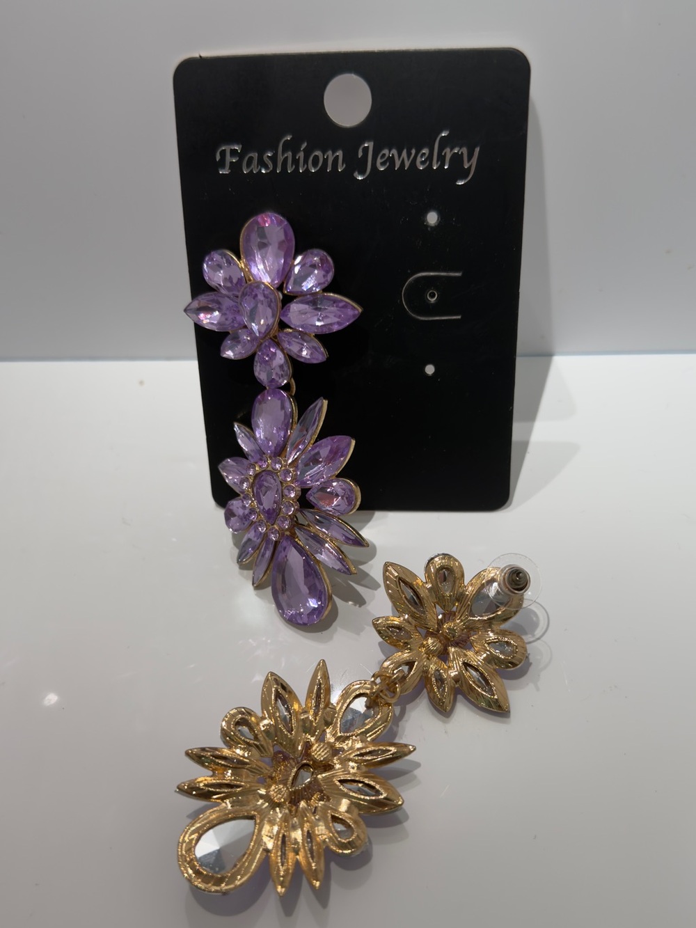 Long floral earrings with lilac stones